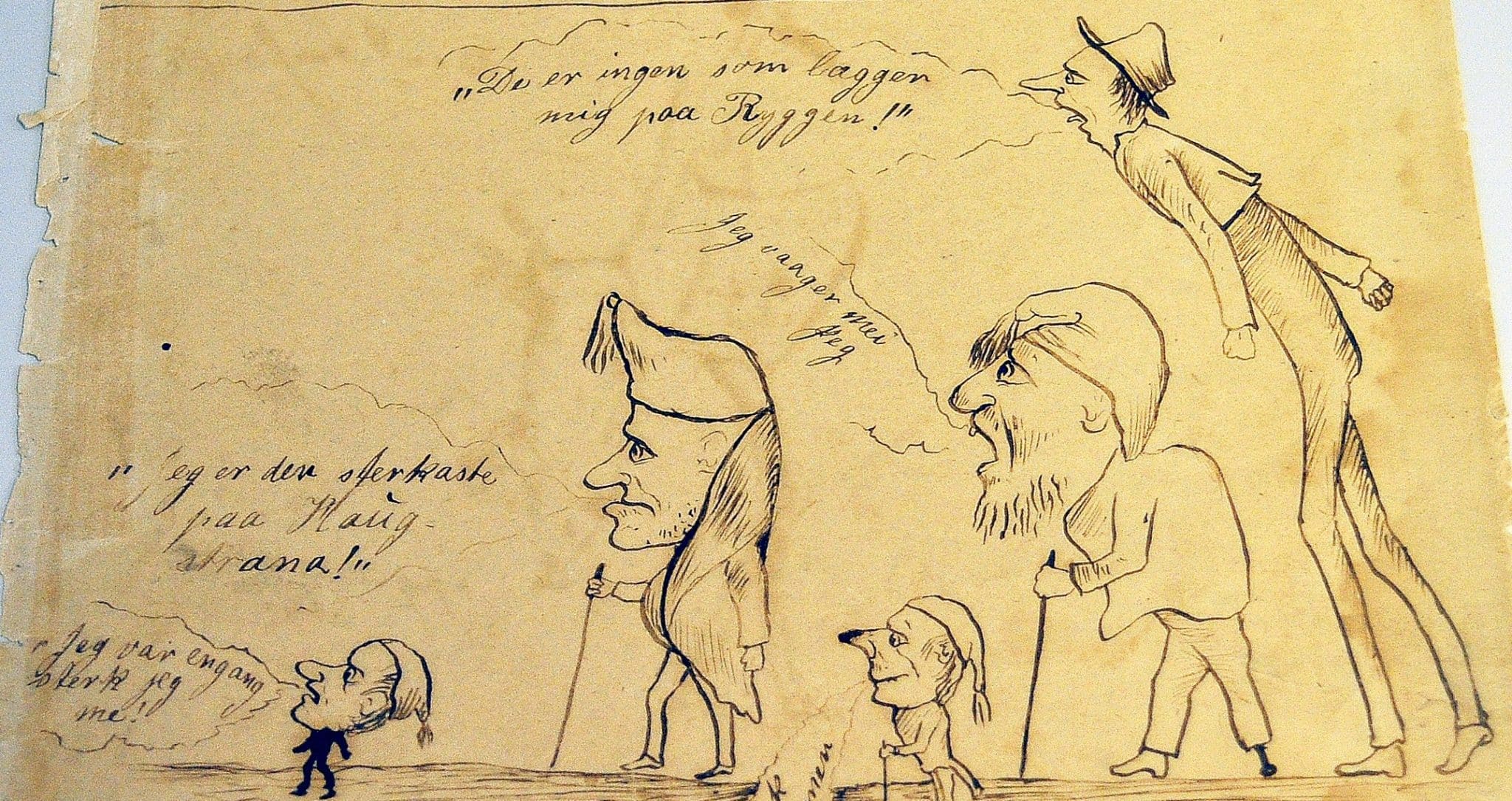 Bildet viser et utsnitt fra en av Th. Kittelsens barnetegninger. Rare menneskefigurer, alle med luer, tegnet med blyant eller penn på et gulnet papir. Alle figurene har snakkebobler med tekst, som for eksempel "De er ingen som lægger mig paa Ryggen!" og "Jeg vaager mei jeg"